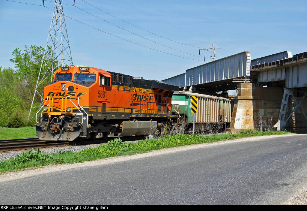 BNSF 5881 Works Dpu on a grain train.
